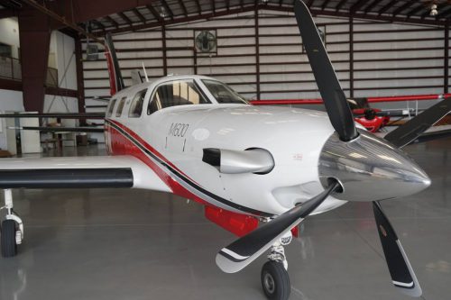 complex piper aircraft in hangar